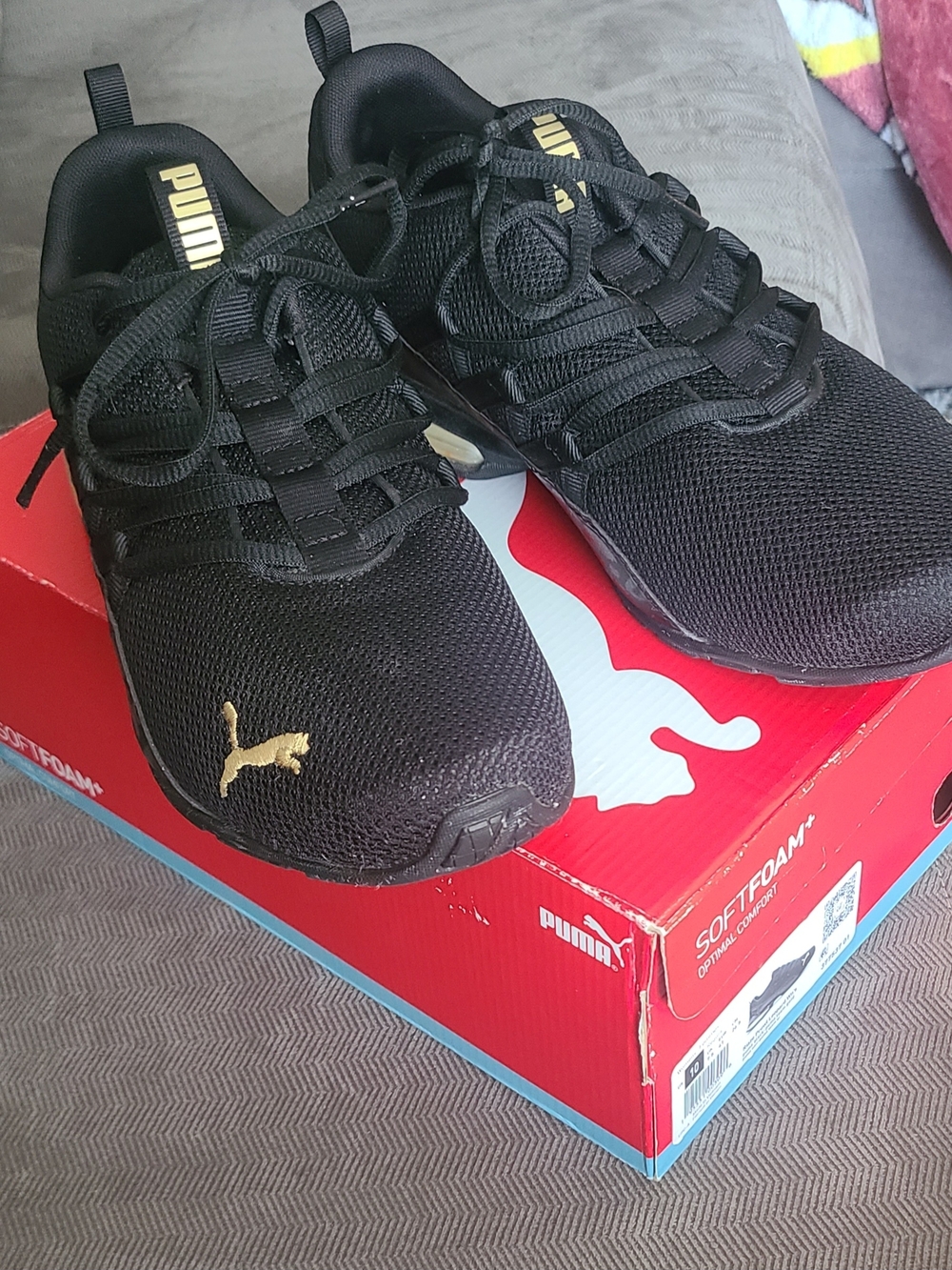 Puma Black Sneakers with Gold Insole Accent